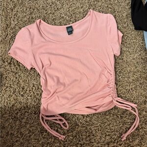 Short sleeved pink cropped top with ties on side